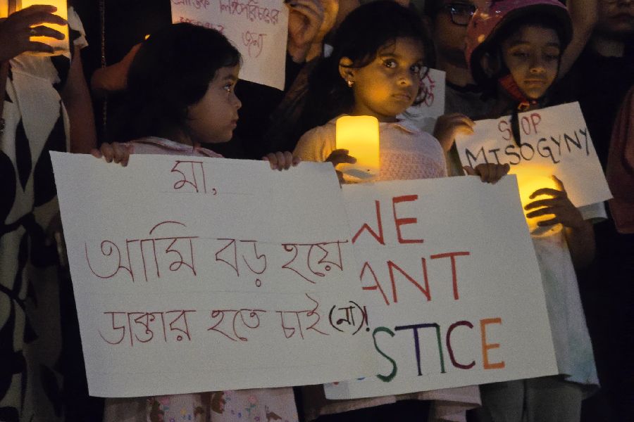 Little girls with placards ask for justice. 