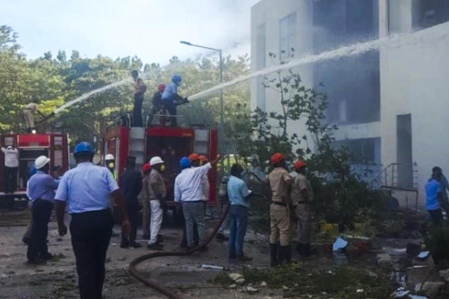 Firefighters douse a fire which broke out following an explosion in a reactor pharma unit of pharmaceutical company Escientia, in Anakapalle, Andhra Pradesh, Wednesday, Aug. 21, 2024.