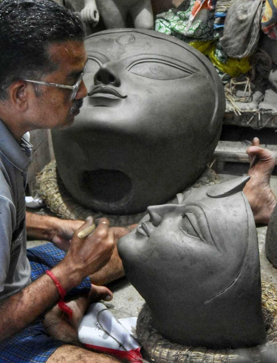 A Kumartuli artist sculpts a Durga idol a month and a half ahead of Durga Puja, which begins on October 9 this year   
