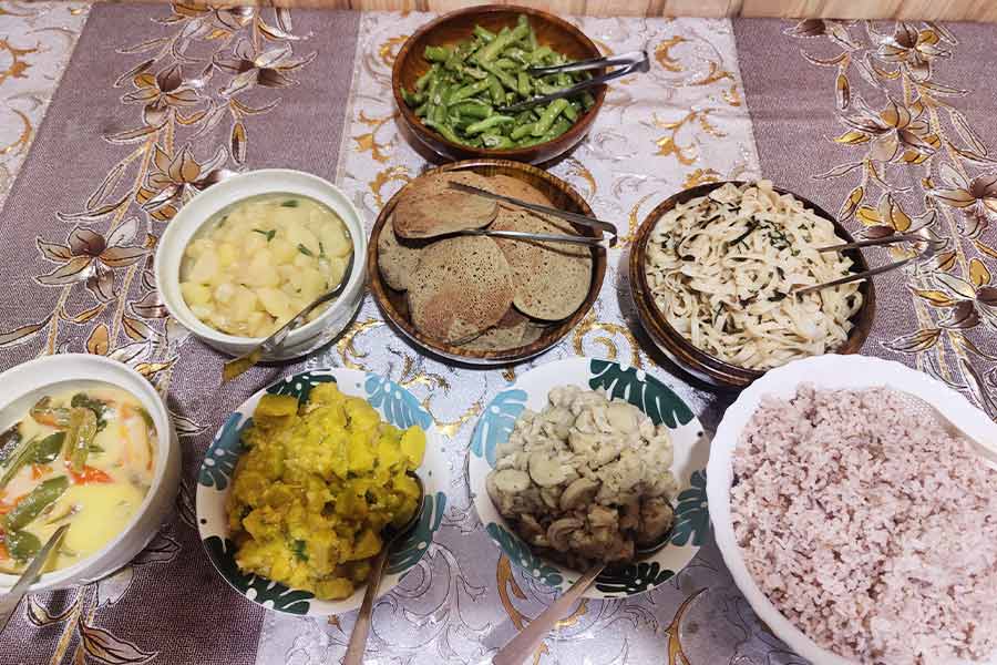 A farmhouse lunch of 'ema datshi', buckwheat pancakes and flat noodles called 'jambuli', near Tamshing Lhakhang
