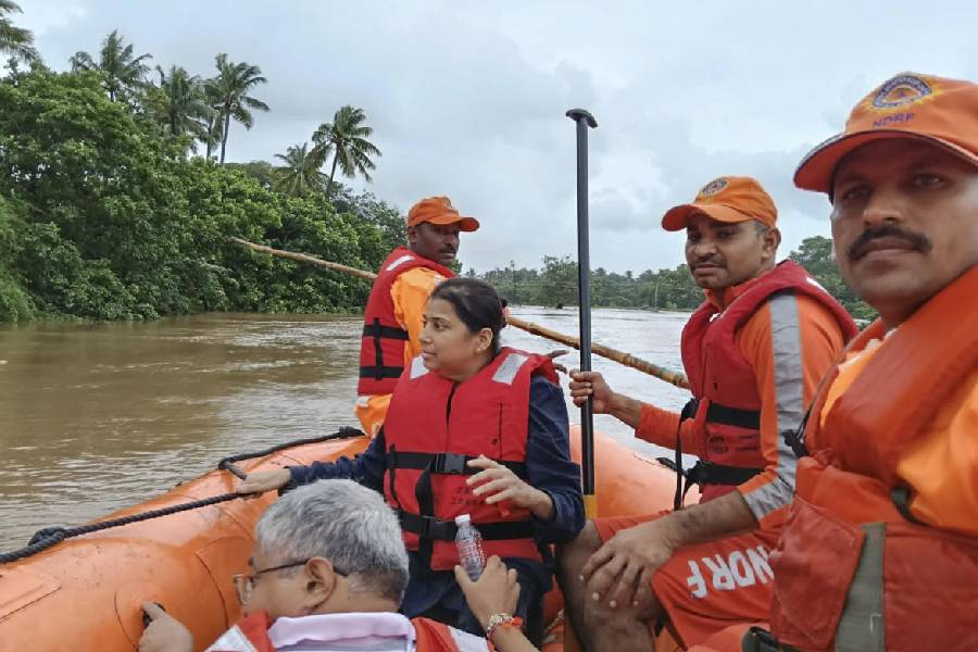 NDRF personnel during a relief operation in flood affected areas of Navsari on August 26, 2024.
