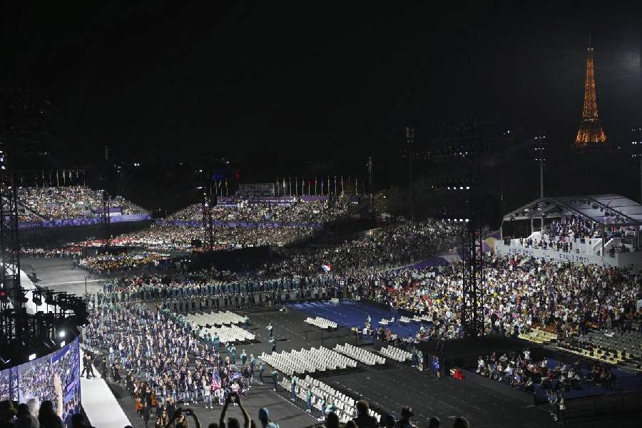 The United States, foreground left, and France, center right, athletes parade during the Opening Ceremony for the 2024 Paralympics, Wednesday, Aug. 28, 2024, in Paris, France.