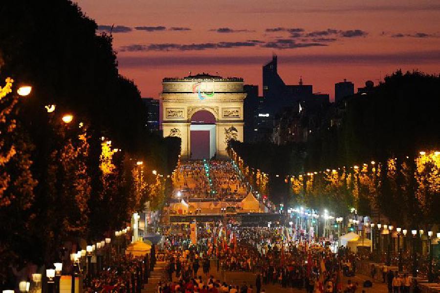 Athletes from different delegations parade on the Champs-Elysees avenue with the Arc de Triomphe in the background, during the Paris 2024 Paralympic Games Opening Ceremony in Paris on August 28, 2024.