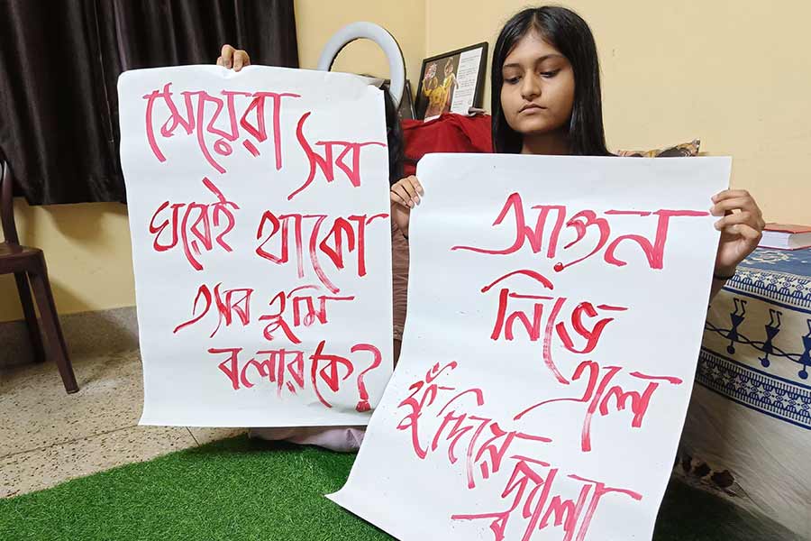Jhil with the posters prepared for the protest 