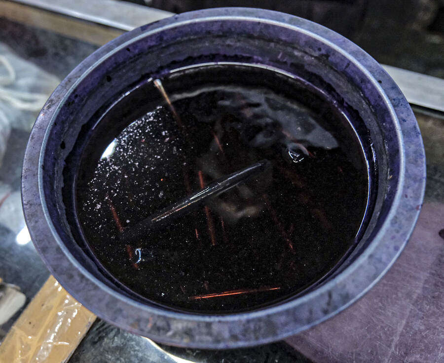 A special solution where pens are dipped and kept for sometime while repairing them