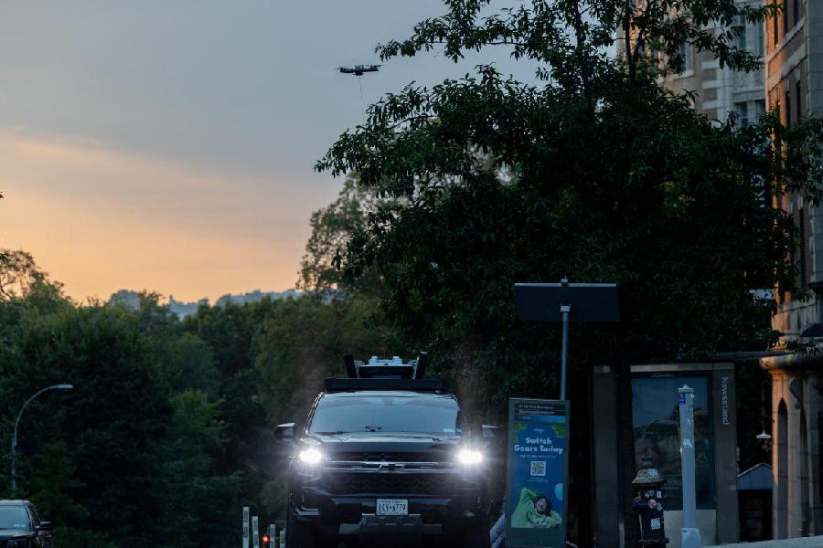 New York Police Department (NYPD) law enforcement officials surveil protesters gathered at a main entrance in front of Columbia University, from inside a vehicle using a drone, amid the ongoing conflict in Gaza between Israel and Hamas, in New York City, U.S., August 25, 2024.