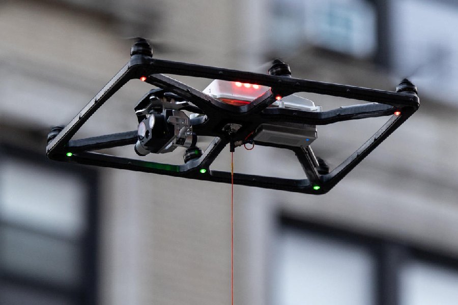 New York Police Department (NYPD) law enforcement officials surveil protesters gathered at a main entrance in front of Columbia University, from inside a vehicle using a drone, amid the ongoing conflict in Gaza between Israel and Hamas, in New York City, U.S., August 25, 2024