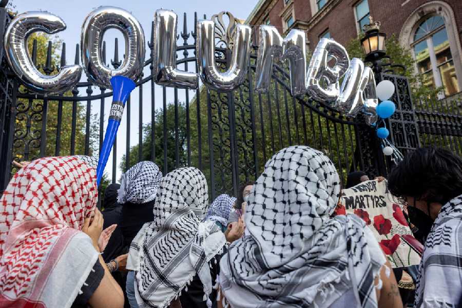 Protesters gather as students and families arrive for convocation, in front of a main gated entrance of Columbia University, amid the ongoing conflict between Israel and Hamas, in New York City, U.S., August 25, 2024.