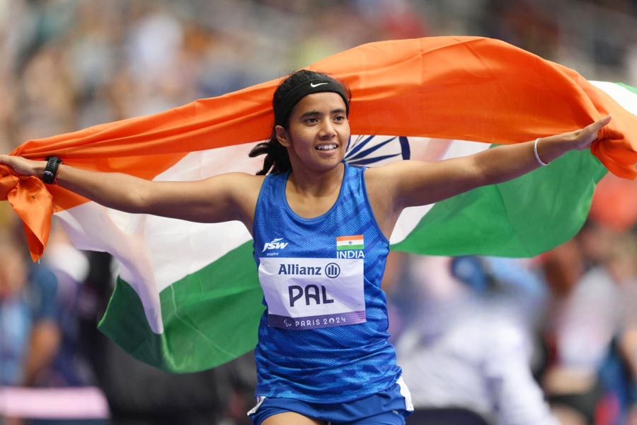 Preethi Pal celebrates after winning India's first athletics medal in Paris Paralympics 2024.