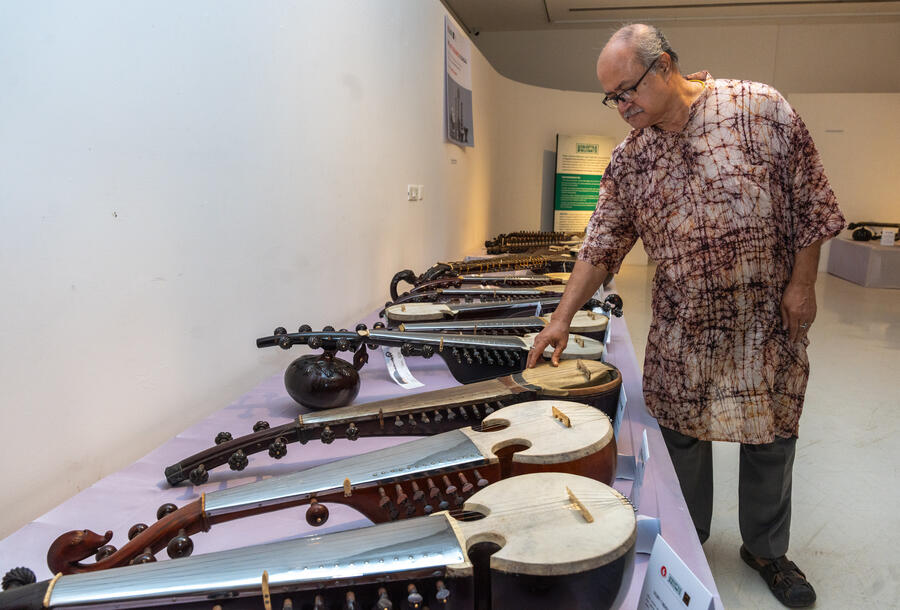 Dasgupta is seen strumming the strings of a sarod, specially attuned to the style of Radhika Mohan Maitra