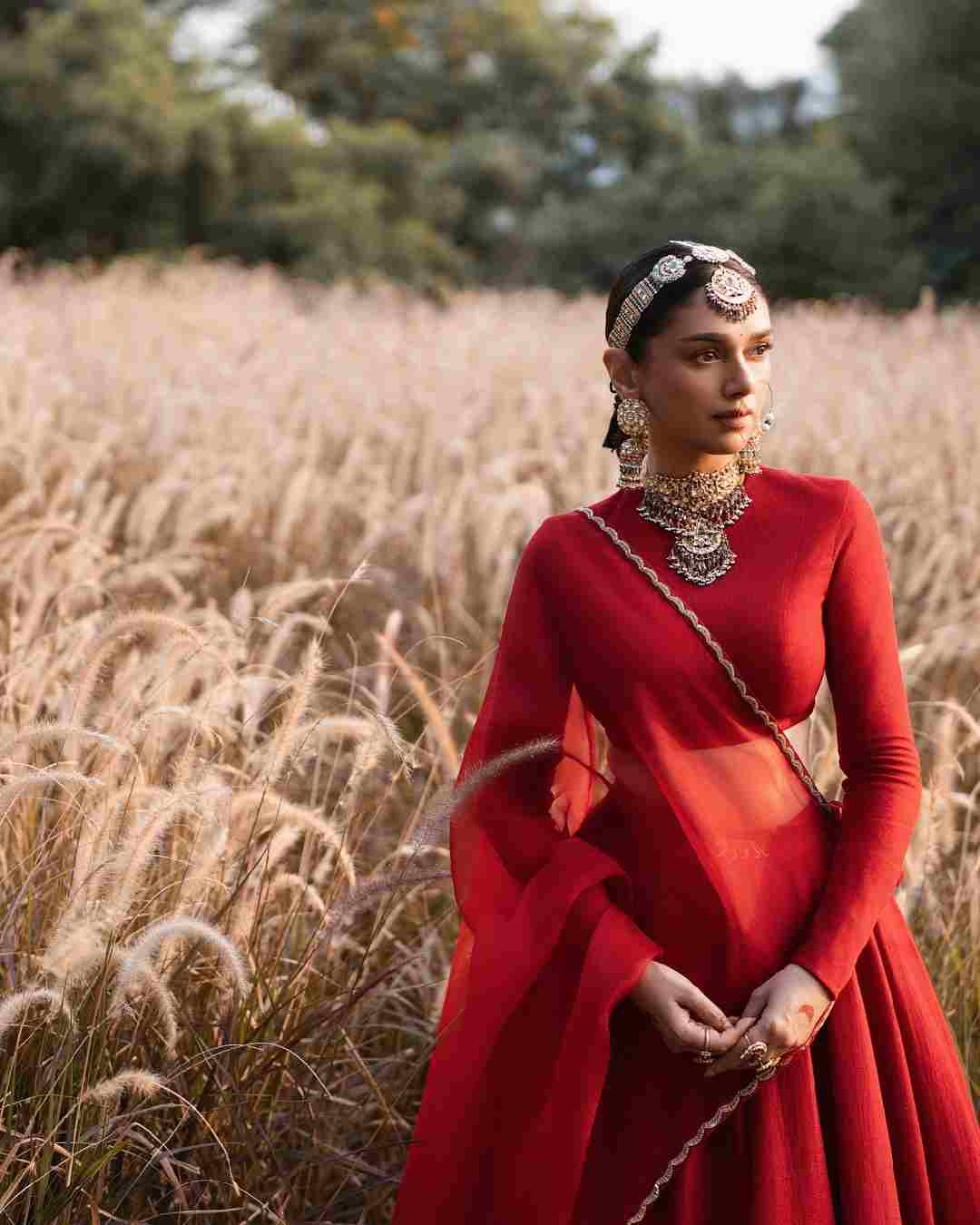 Dressed in her bridal ensemble, Aditi Rao Hydari posed for pictures in a barley field in Rajasthan.