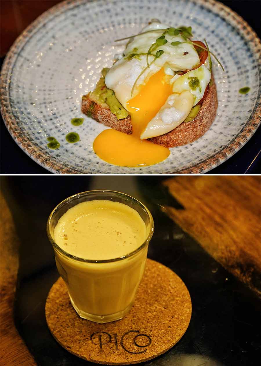 The third plate is a Tomato and Bocconcini Cheese Bruschetta — bread layered in basil pesto sauce and topped with fresh bocconcini cheese and cherry tomatoes, and a drizzle of balsamic vinegar. The bruschetta is paired with a cold brew. The last of the small plates is a sourdough with a guacamole spread topped with a poached egg that is served along with a vanilla ice latte