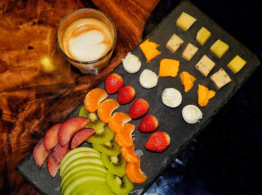 To break up the courses, you are next served with a platter of cheese and fresh fruits. It includes gouda, mild cheddar, bocconcini and smoked black pepper-flavoured cheese, accompanied by strawberries, oranges, green apple, kiwi and plum. The platter works as a palate cleanser and is served with a hot cuppa of cinnamon and ginger coffee
