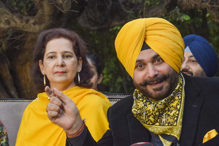 Congress leader Navjot Singh Sidhu with his wife Navjot Kaur Sidhu addresses a press conference, in Amritsar, Thursday, Nov. 21, 2024.