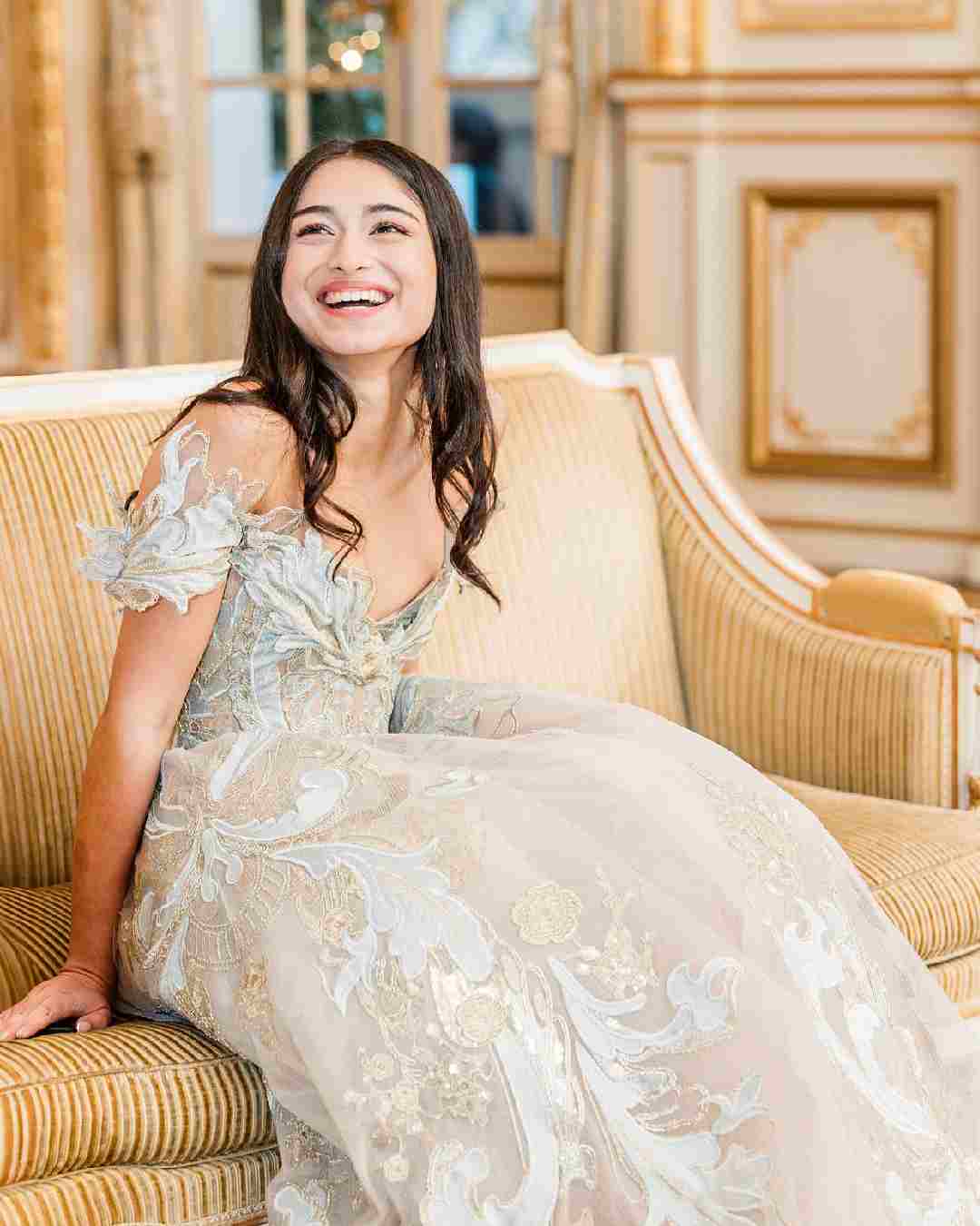 Rysa's off-shoulder gown featured floral embroidery and a floor-sweeping train. 