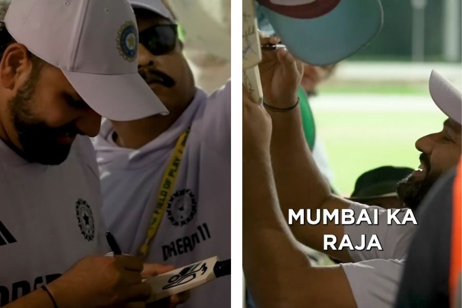 Rohit Sharma signs an autograph for fan