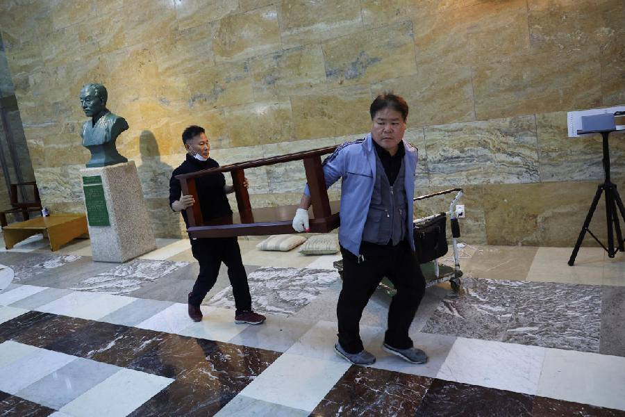 Men at work at the National Assembly building after martial law was reversed.