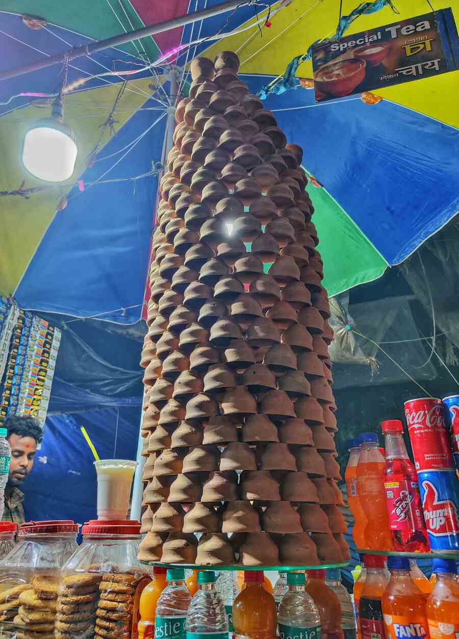 As the winter chills hit the air, a tea seller in Esplanade stacks up the clay pots to meet  the demand for 'bhnarer cha' (tea in clay pots) 