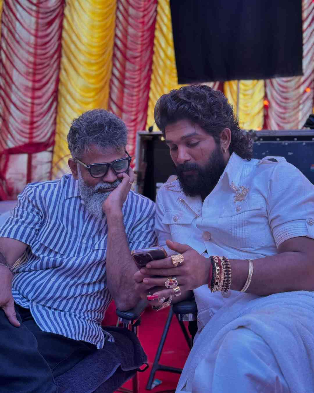 Allu broke into laughter in one of the pictures, where he sports a sari for the Jaathara sequence of the film. 