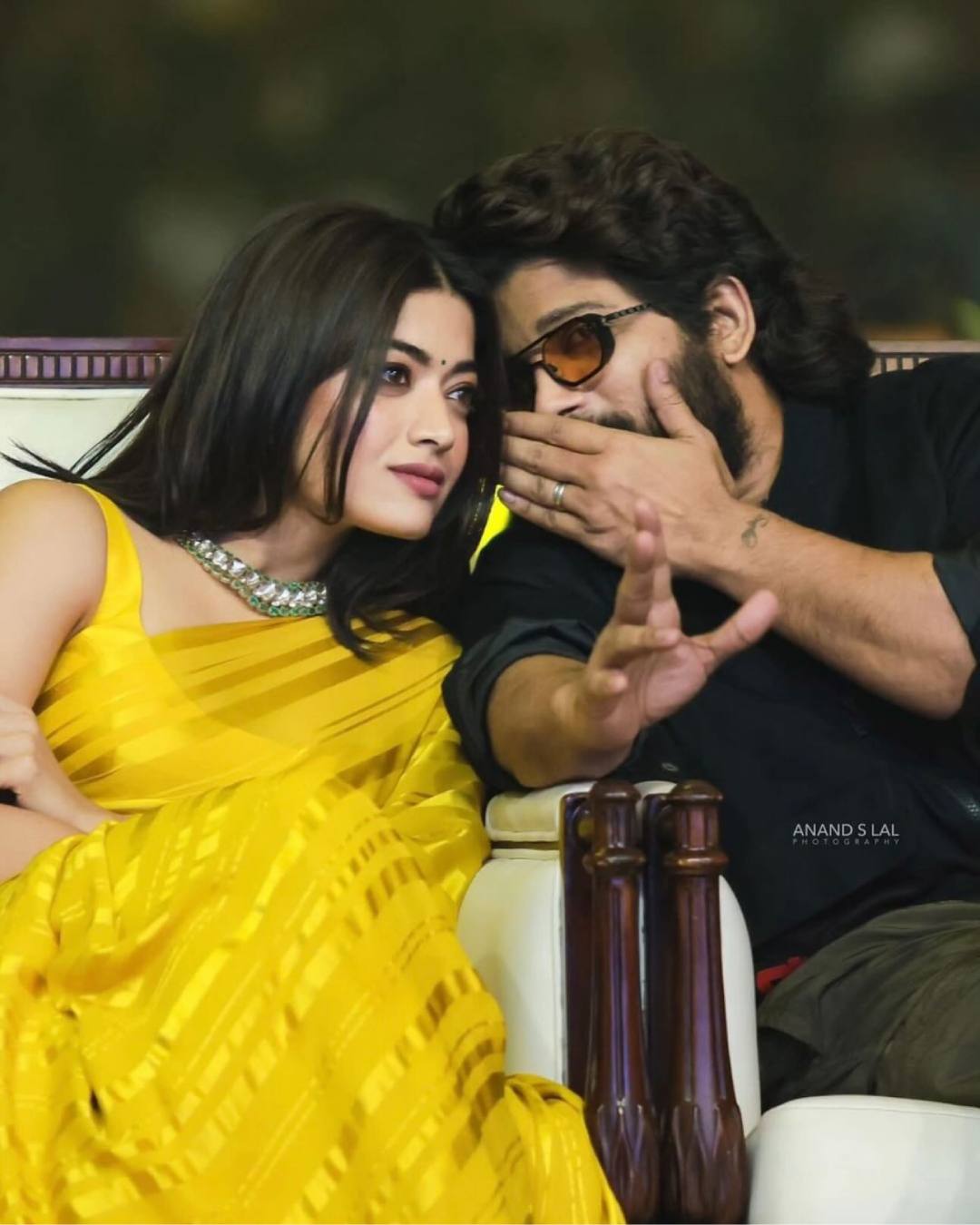 Allu whispered in Rashmika’s ears during a promotional event. While the Animal actress looked stunning in a yellow sari, Allu wore a black t-shirt and olive pants. 