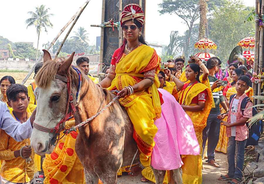 Subhadra, a girl from Raynagar in Barasat, rides a horse to her wedding. The bride broke gender stereotype of the groom arriving on a horse