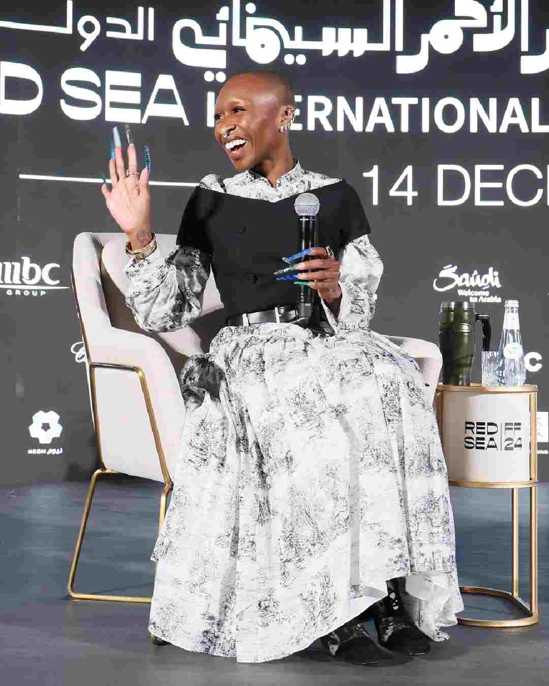 Wicked star Cynthia Erivo wore a monochrome dress on Day 2. She paired it with a black off-shoulder waistcoat and a black belt. A pair of monochrome boots perfectly complemented Cynthia’s outfit.  