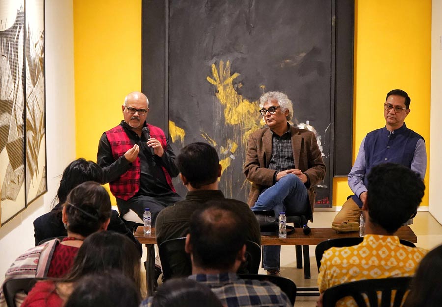 Niladri Ranjan Chatterjee (left), professor of English, Kalyani University, moderated an interesting discussion centered on the question, “Is it art if it doesn’t disturb?”, between theatre and film director Suman Mukhopadhyay (centre) and assistant professor of visual arts at Kalyani University, Ritendra Roy (right) at CIMA amid the ongoing exhibition, ‘Shape Without Form, Shade Without Colour’. Behind the panellists hangs an untitled artwork by Chittrovanu Mazumdar