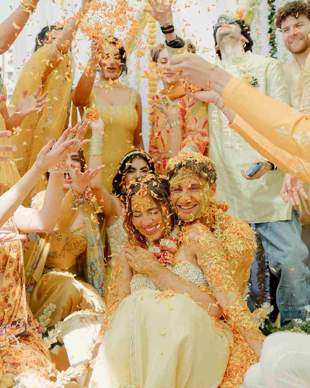 Aaliyah and Shane embraced each other as their friends showered petals on them.