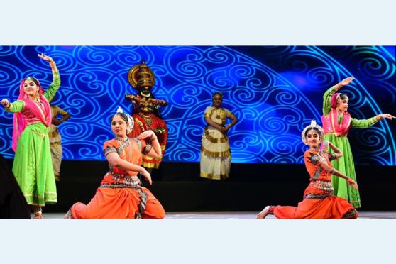 A performance showcased various Indian classical dance forms on-stage. 