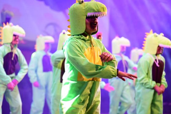 An adorab;e moment from the performance titled 'Dinosaur Dance' on display.