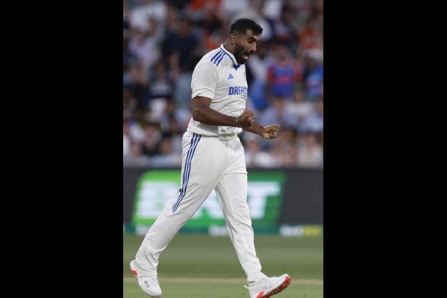 India's Jasprit Bumrah celebrates the dismissal of Australia's Usman Khawaja during the day one of the second cricket test match between Australia and India at the Adelaide Oval in Adelaide, Australia, Friday, Dec. 6, 2024.