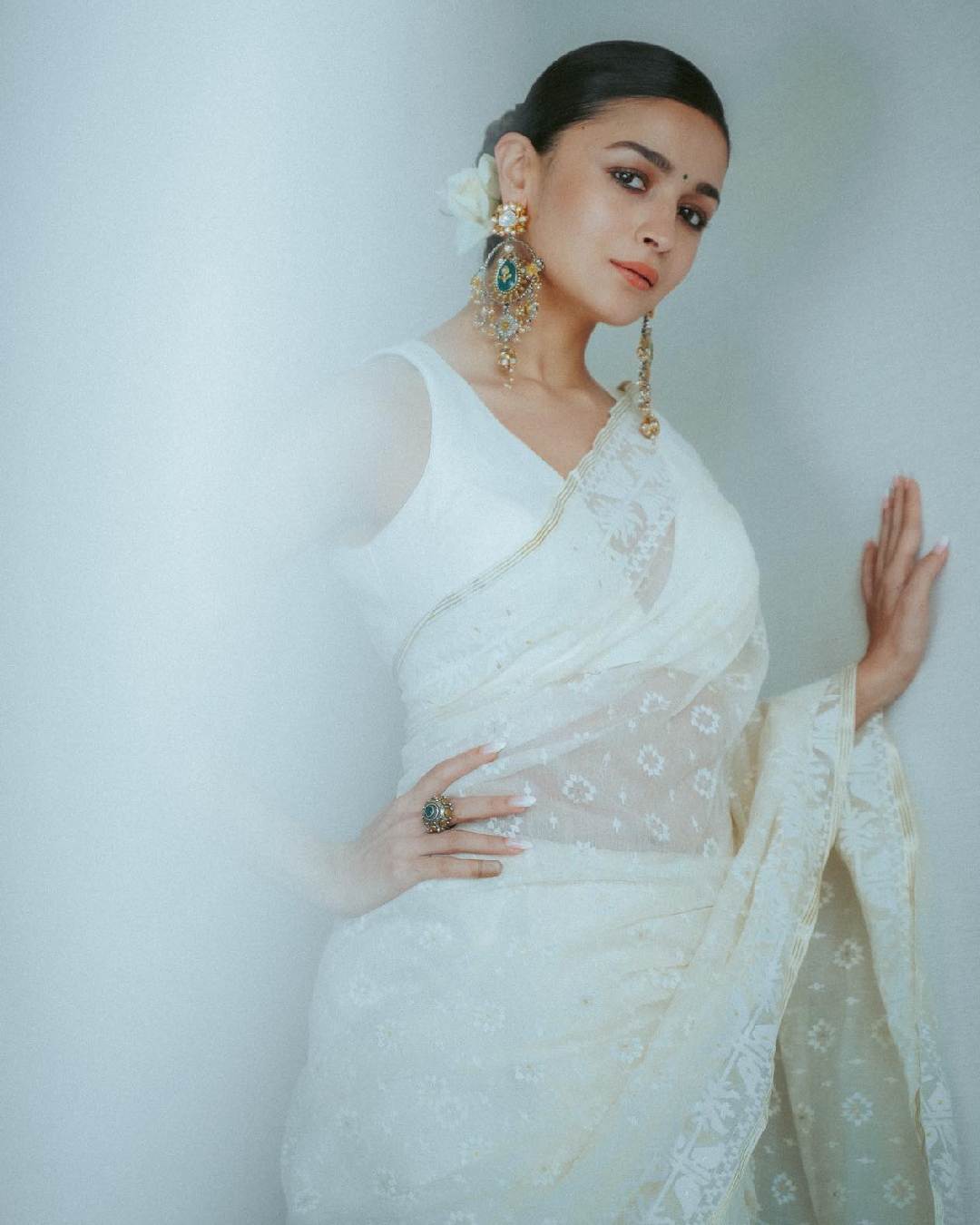 Alia Bhatt went all glam during a visit to Kolkata, turning heads in a sheer white sari paired with a V-neck blouse.
