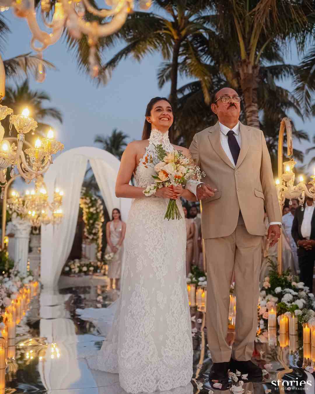 Keerthy walks down the aisle with her father.