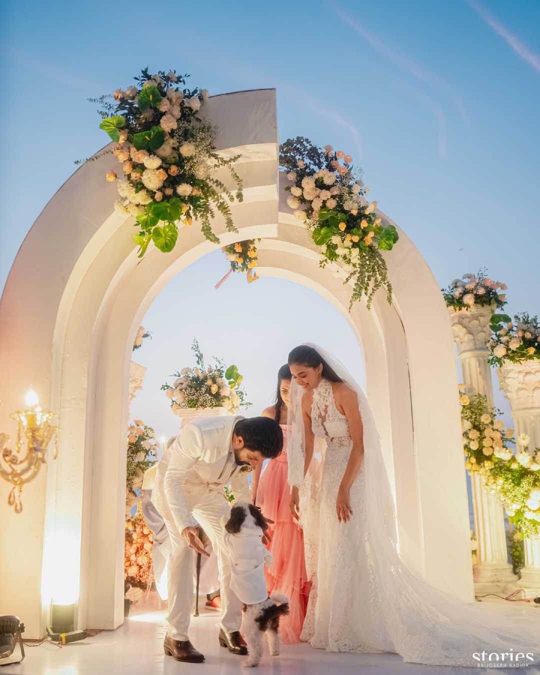 One of the pictures shows the couple sharing a heartwarming moment with their pet dog.