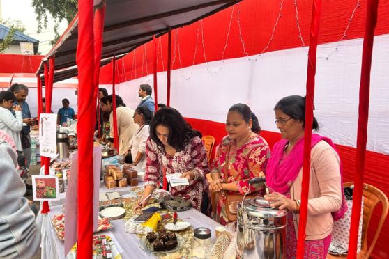 A stall selling food items at the Christmas Carnival