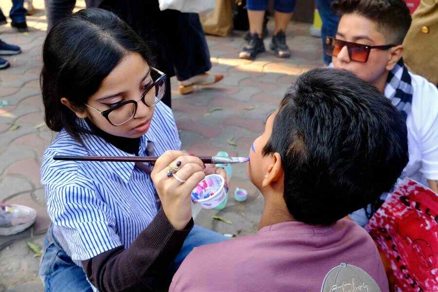 Riddhi Khan reinforced the importance of expressing through appearance by offering to touch-up cheeks with flags before the walk began. ‘My dad is an artist and I stole some of his colours for today!’ she chuckled