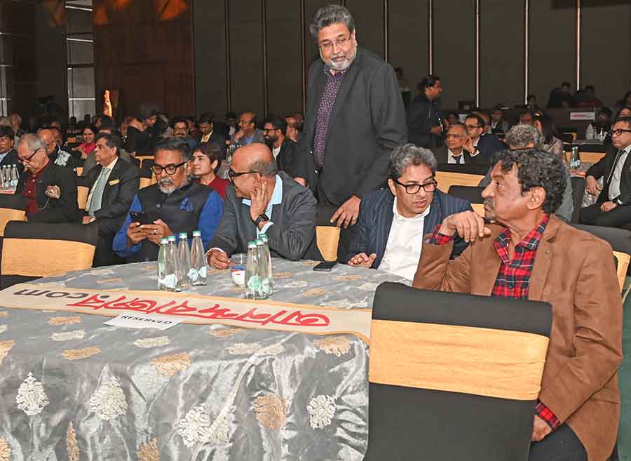 Alapan Bandyopadhyay, chief adviser to West Bengal chief minister Mamata Banerjee, converses with filmmaker Goutam Ghose as Ambuja Neotia Group chairman Harsh Neotia joins them