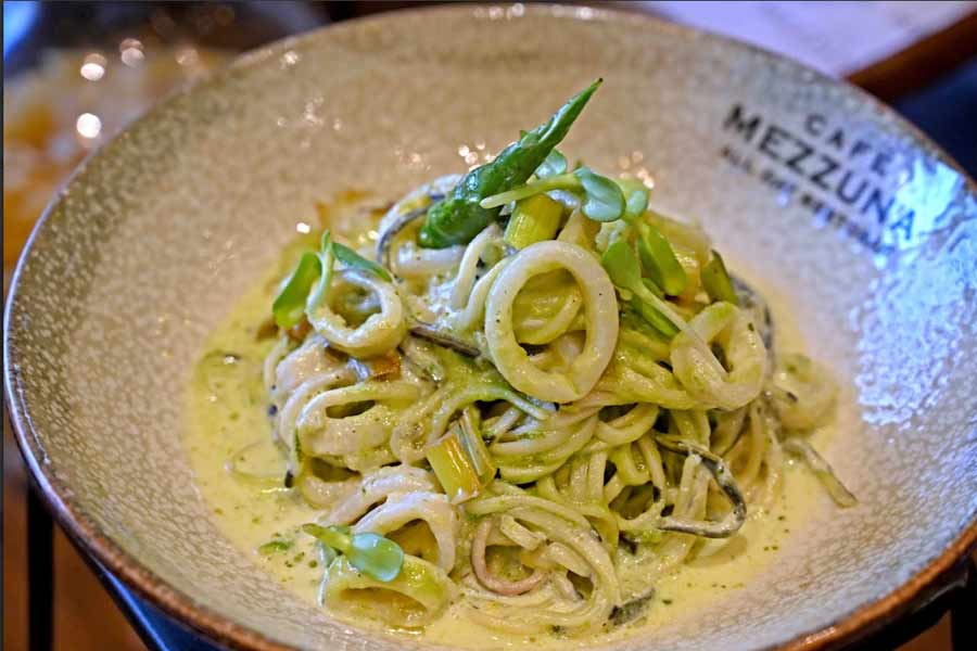 The a la carte menu includes vegetarian, non-vegetarian and vegan options. The pastas are handmade and eggless. In picture, a Linguine pasta with calamari and green chillies, in a charred leek sauce