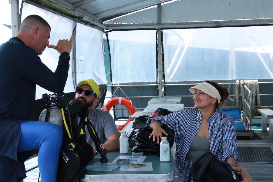 A candid photo captures a light-hearted moment between Sonakshi, Zaheer and their dive guide, Chris.