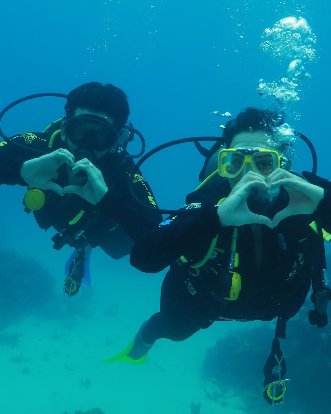 A photo clicked underwater shows Sonakshi and Zaheer forming heart signs with their hands. 