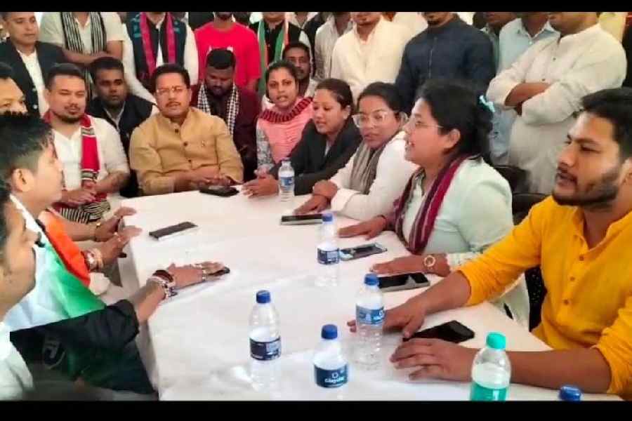 Bhupen Kumar Borah with other party colleagues during their police detention on Friday.