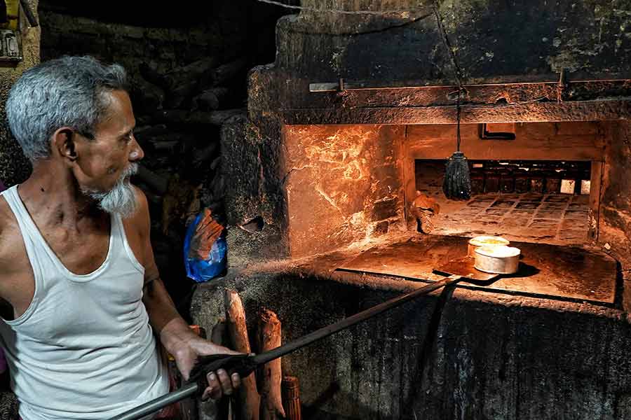 The century-old wooden ‘bhatti’ (oven) at the K Ali Bakery is an inheritance from its founder, Kausar Ali