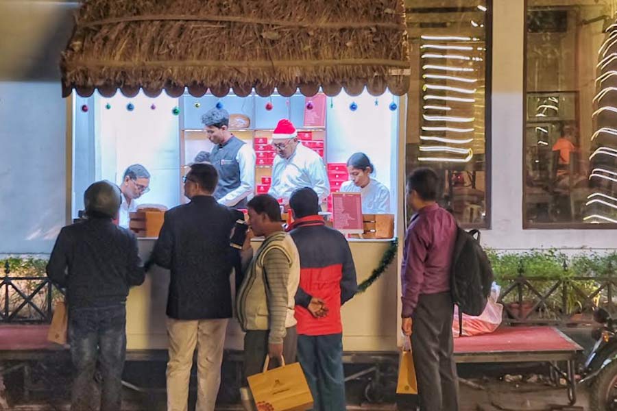 Customers mill around The LaLit Great Eastern Kolkata bakery on Christmas Eve for its famous Christmas Cake