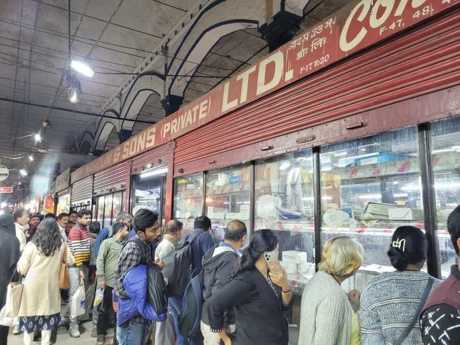 Customers form a snaking queue through New Market to buy their favourite cakes and savouries on Christmas Eve from Nahoum 