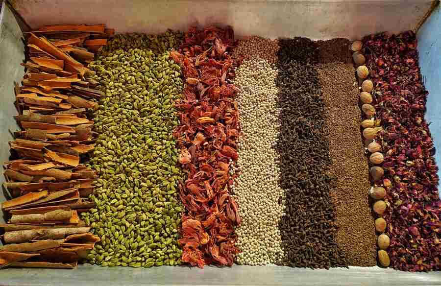 Eight spices like cardamom, cinnamon, clove, mace, nutmeg, white pepper, cumin and rose petals were neatly lined up ready to be mixed