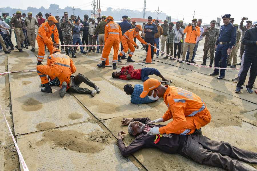 SDRF personnel conduct a mock drill to tackle stampede-like situations, in Prayagraj, Friday, Dec. 27, 2024. PTI