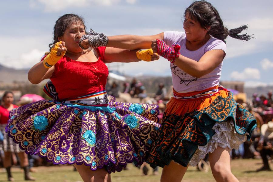 Southpaw with the jab: Women dressed in traditional costumes lock horns at the annual Takanakuy festival, which means to "hit each other", in Quechua, in Llique, Chumbivilcas province, Peru December 26, 2024. Reuters