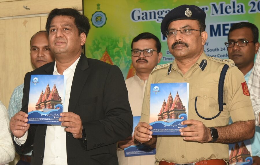 Sumit Gupta, IAS, district magistrate and district collector, South 24-Parganas, and Koteswara Rao, IPS, superintendent of police, Sundarban Police District, release the Gangasagar Mela 2025 booklet at the New Administrative Building in Alipore  