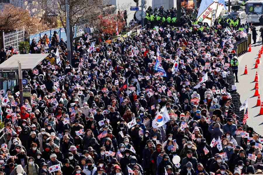 People in favour of Yoon Suk Yeol's arrest take to the streets as well. Reuters
