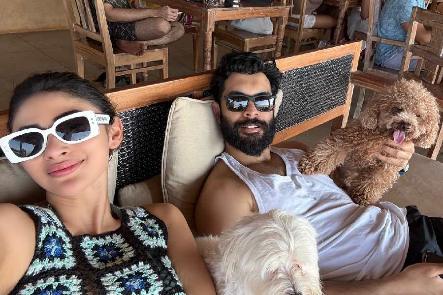 Mouni Roy and husband Suraj Nambiar are enjoying a vacation with their pet dogs at an undisclosed coastal location abroad. 